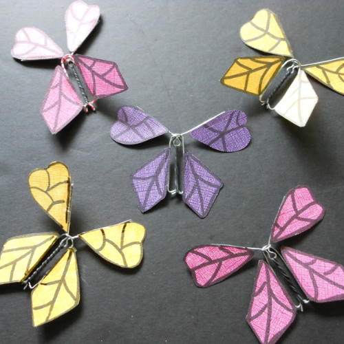 Mechanical and paper butterflies yellow, purple, and pink 