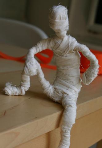 Image of mummy sitting on a desk