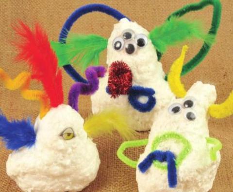 Ivory Soap shaped into monsters with goggle eyes, feathers, and pipe cleaners